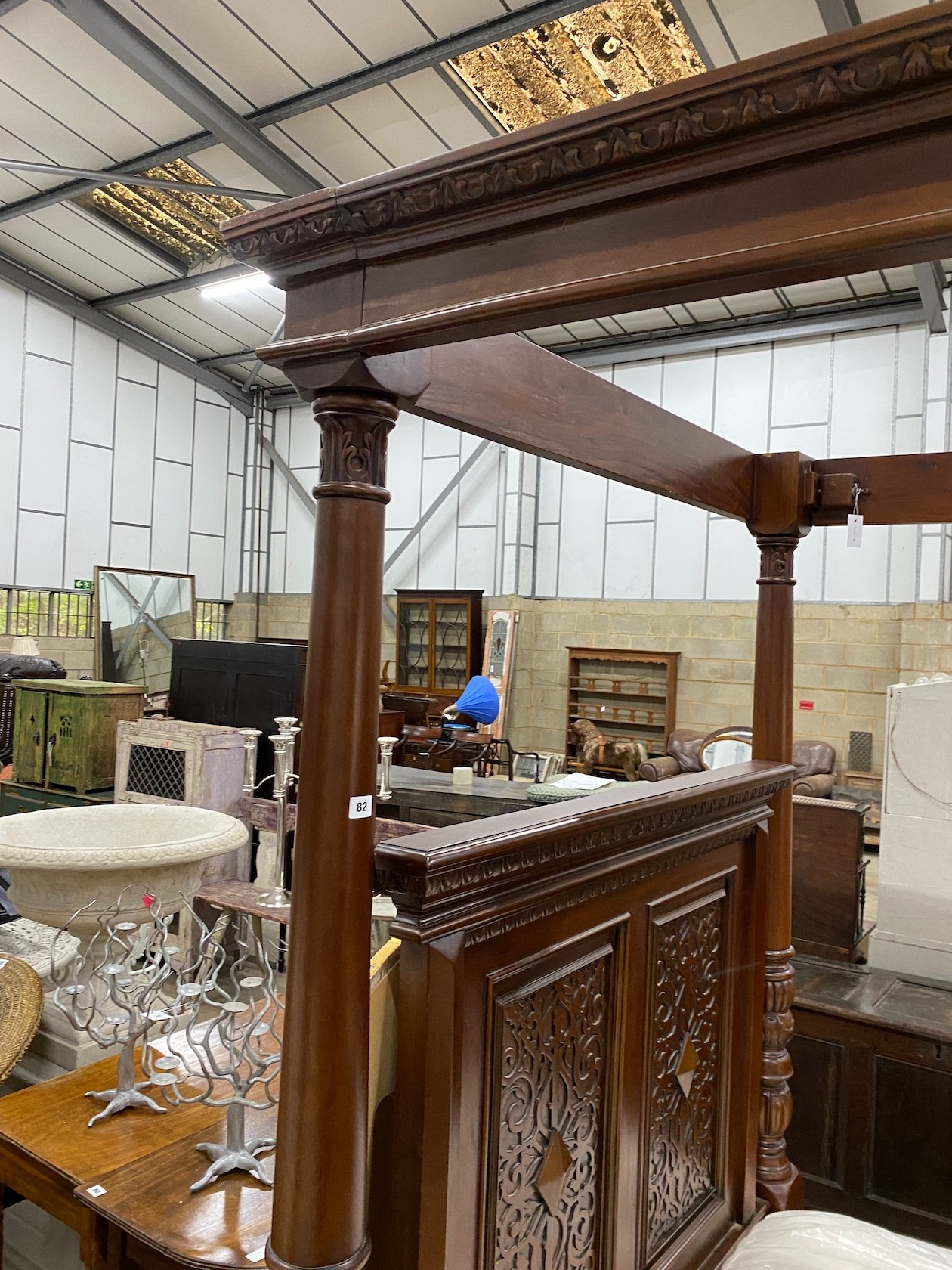 A reproduction carved mahogany four poster double bed frame with Visprung Lynton mattress, width 150cm, length 210cm, height 218cm